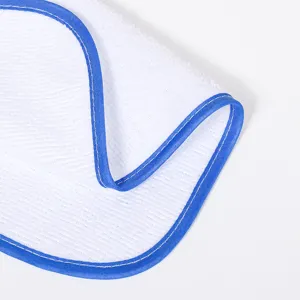 Close up of white microfiber cleaning cloth with blue edge binding, showing detailed fabric texture.