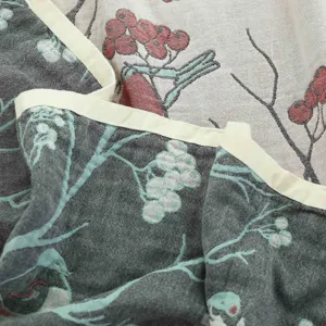 Cotton gauze blanket summer air conditioning quilt with vintage bird floral print and bound edge.