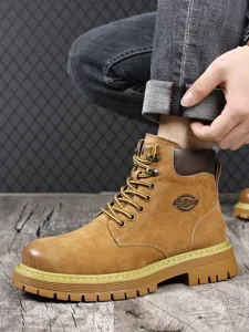Men brown suede Martin boots detail, vintage high-top work footwear with durable thick rubber sole.