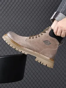 Close-up of men's winter fleece-lined Martin boot, showing nubuck texture and lug sole.