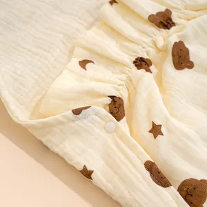 Baby summer cotton gauze sleeping bag detail view with cute bear print and ruffles, breathable.