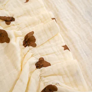 Soft cotton gauze baby sleeping bag fabric detail, breathable summer newborn blanket close-up.