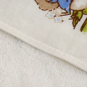 Detailed view of soft cotton baby handkerchief showing delicate edge stitching and cute print.