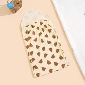 Cute brown bear print gauze baby sleeping bag detail, showing soft cotton fabric texture.