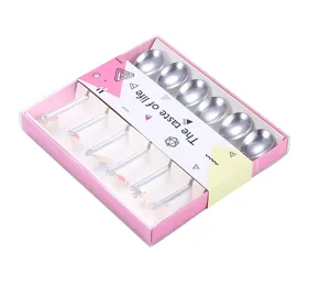 Stainless steel spoon set with cute charms in pink gift box, perfect for coffee and desserts.