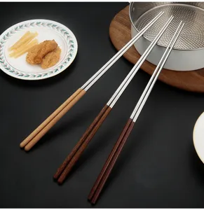 Long stainless steel chopsticks with wooden handle detail, heat resistant kitchen tool.