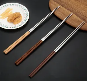 Stainless steel wooden handle chopsticks detail view, long cooking chopsticks for kitchen.