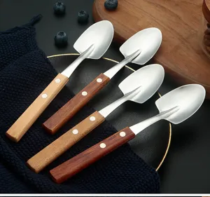 Stainless steel shovel shaped spoons, detailed view of wooden handle dessert and fruit spoons.