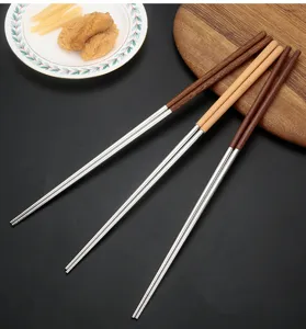Stainless steel frying chopsticks with wooden handle detail, long cooking design for kitchen use.