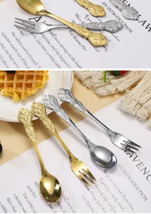 Vintage embossed stainless steel spoons and forks detail, luxury gold silver tableware set.