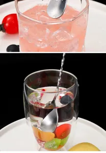 Detailed view of the stainless steel long handle mixing spoon used in a clear glass drink.
