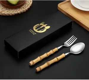 Stainless steel cutlery detail showing bamboo-style handle fork and spoon with gift box.
