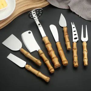 Stainless steel cheese knife set with natural bamboo handles, butter knife and kitchen tools.