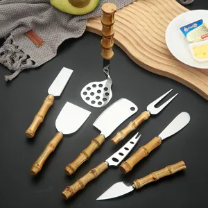 Stainless steel kitchen tool set with bamboo handles, cheese knives, butter knife and masher.