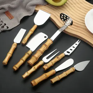 Stainless steel cheese knife set with bamboo handles, kitchen utility tools for food prep.