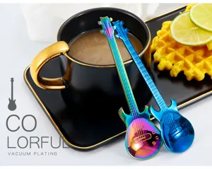 Creative guitar shaped stainless steel stirring spoon, detail view of metal coffee spoon.