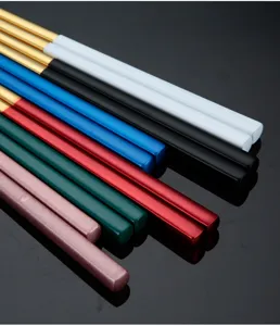 Close-up detail of modern square metal chopsticks in various stylish vibrant colors.