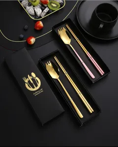 Stainless steel cutlery set with gift box, gold fork spoon and chopsticks for dining.