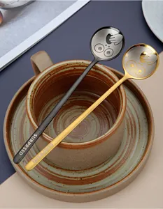 Creative 304 stainless steel coffee spoon set with cute funny face design and stylish handle.