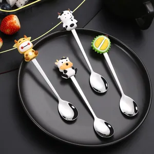 Cute cartoon stainless steel spoon set with silicone cow and fruit handles for coffee dessert.