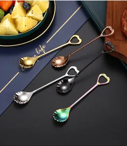 Stainless steel shell shaped coffee spoon dessert mixing spoon detail view, elegant tableware.