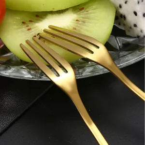 Gold stainless steel fruit forks for dessert and cake, elegant kitchen tableware set.