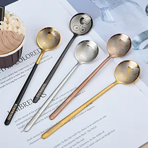 Creative 304 stainless steel coffee spoons set with cute cartoon face designs and handles.