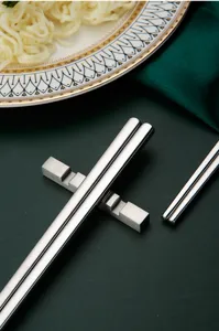 Stainless steel chopstick detail close-up showcasing modern minimalist metal texture and finish.