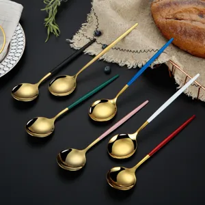 Stainless steel golden round spoon set with colorful handles, elegant cutlery for dining.