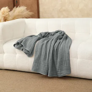 Detail view of the pure cotton 6-layer gauze baby blanket, soft grey texture for kids.