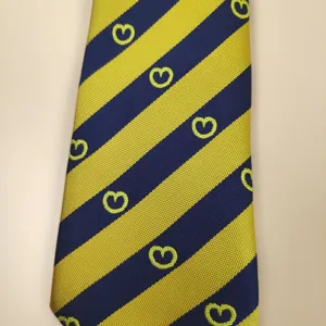 Striped school uniform tie detail showing blue and yellow pattern with cute heart prints.