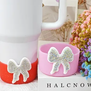 Silicone cup boot and coaster set with rhinestone bow, anti-slip Stanley tumbler accessories.
