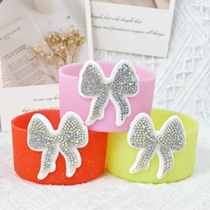 Detailed showcase of silicone cup boot featuring rhinestone bow, designed for 7.5cm Stanley tumblers.