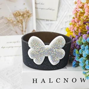 Silicone cup sleeve detail view featuring a sparkling rhinestone bow accessory for Stanley cups.