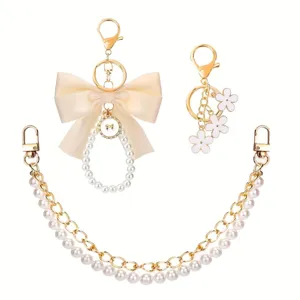 Parel strik tas bedel bloem sleutelhanger en dubbele ketting set elegante accessoire
