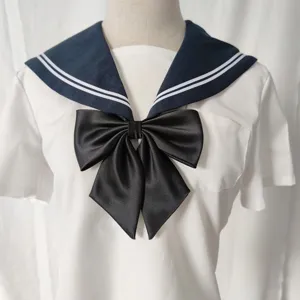 Japanese style sailor uniform top with large black bow tie, short sleeve white shirt.