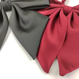 Japanese style large bow tie for sailor uniform, solid color fabric accessory detail shot.