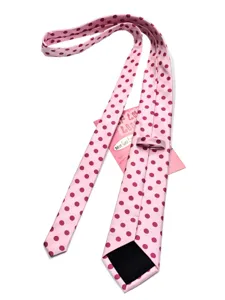 Raspberry pink polka dot detail view showcasing fabric texture and woven pattern design.
