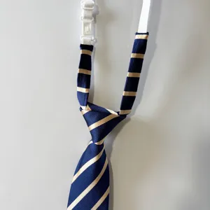 Detailed shot of navy blue and gold striped pre-tied men necktie with elastic neck strap.