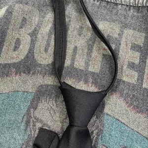 Detailed view of the black zipper necktie featuring quality fabric texture and punk design elements.