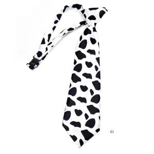Close-up detail of the cute black and white cow print short clip-on necktie for kids.