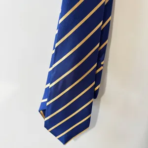 Close-up detail of classic navy blue and yellow striped men necktie, elegant fabric texture.