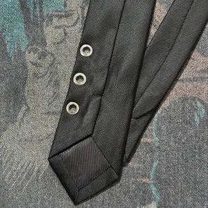 Black punk style necktie with three metal grommets, trendy design for men and women daily wear.
