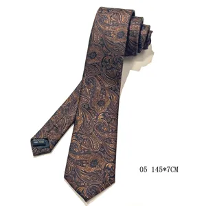Vintage paisley polyester necktie detailed view showing classic brown pattern and fabric label.