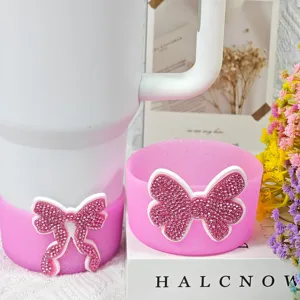 Pink silicone cup boot and coaster detail with rhinestone bow, compatible with tumbler cups.