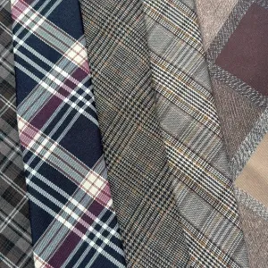 Detailed view of vintage plaid fabric and necktie texture, classic Scottish tartan style.