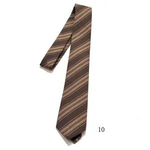 Brown striped tie fabric detail, vintage style men's necktie close-up view pattern.