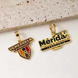 Gold plated metal pendant charms souvenir travel jewelry accessories detailed close-up view.