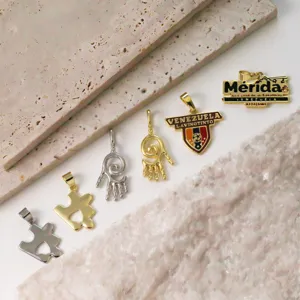 Gold plated and silver metal pendant charms assortment, puzzle and hand designs for DIY jewelry.