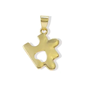 Gold plated puzzle piece pendant with hollow heart cutout, DIY necklace and earring accessory.